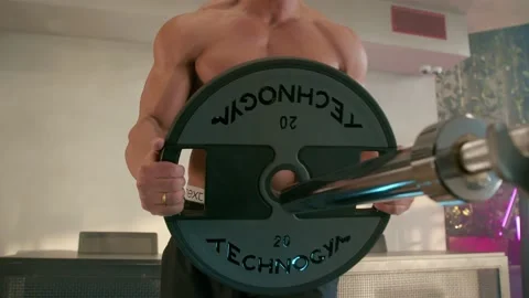 Working out barbell bench press in the gym Stock Footage 239552792