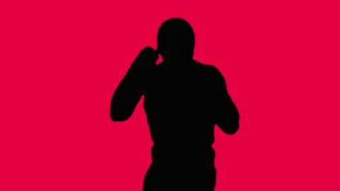 Working out boxer. A fight with a shadow. Stock-Footage 88530442