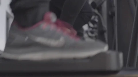 Working out on eliptical Stock Footage 82539617