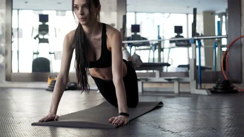 Working out pushups on exercise mat. One real person 20s 30s with sports clothin Stock Footage 199490698