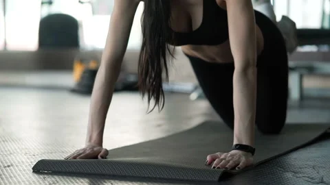 Working out pushups on exercise mat slomo. Caucasian 20s 30s with sports clothin Stock Footage 199490824