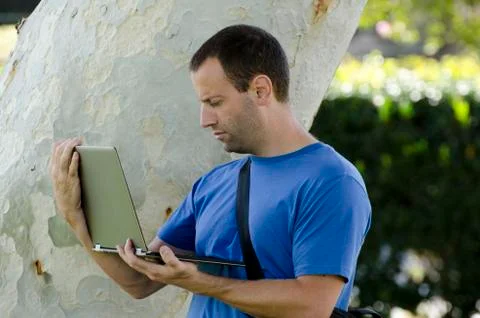 Working outside on a laptop alone. Stock Photos