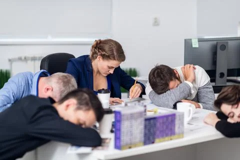 Working overtime to finish a project on time. A young architect Stock Photos