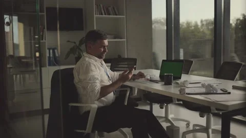 Working overtime in office, tired senior manager trying to relax after workin Stock Footage 201625995