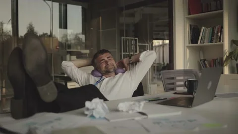 Working overtime in office, tired senior manager satisfied with his work rest Stock Footage 201626053