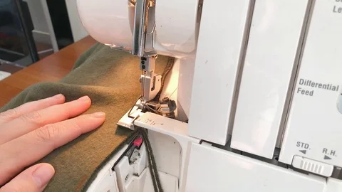 Working part of a sewing machine, hands of a master seamstress. Stock Footage 108336505