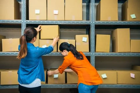 Working partner together to sort out the package. Photos