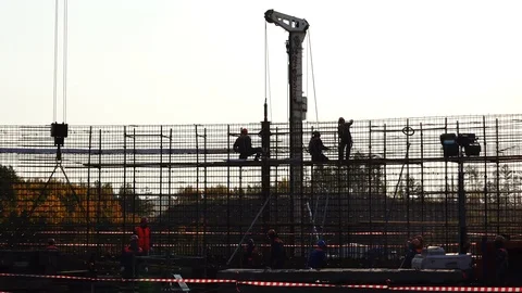 Working people at the top perform assembly work with fittings Stock Footage 74002530