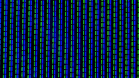 Working pixels in the screen color TV, with a video playback close up. Blue Stock Footage 145913849