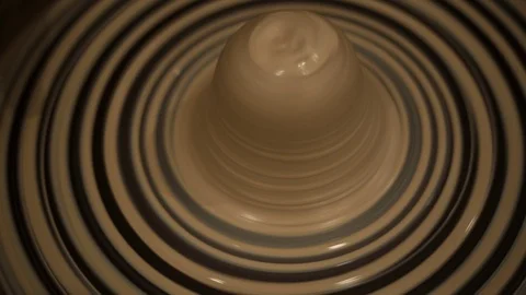 Working on a potter's wheel , making a relief on a clay plate Stock Footage 104629475