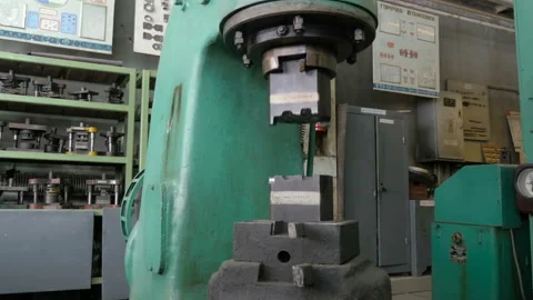 Working the press or hammering machine in industrial production Stock Footage 87784101