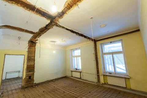 Working process of building rooms with broken walls made and floor prerared for Stock Photos