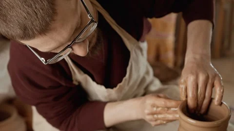 Working process in ceramic workshop. Crafting work concept. Man potter working Video stock 247040108