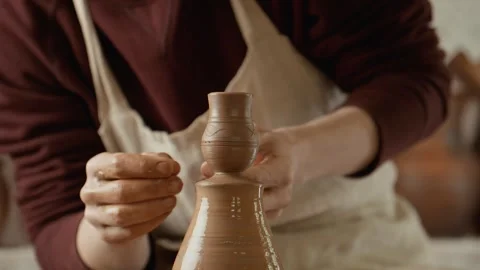 Working process in ceramic workshop. Man works with clay. Potter making vase Stock Footage 242019342