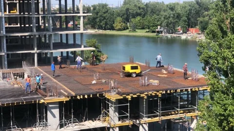 Working process at the construction site. Construction work. Builders at the Stock Footage 197686789