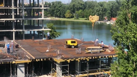 Working process at the construction site. Construction work. Builders at the Video stock 197687105