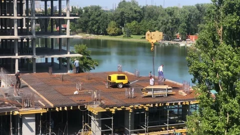 Working process at the construction site. Construction work. Builders at the Stock Footage 201890360
