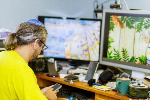 Working process, designer modern office, using computer while sitting at her  Stock Photos