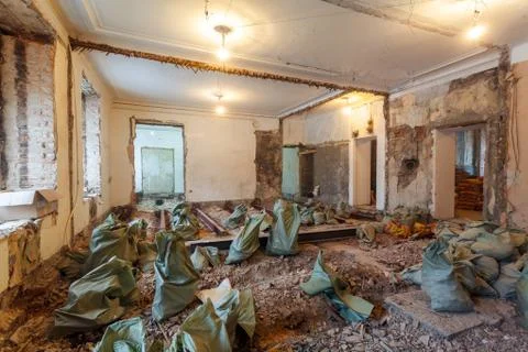 Working process of dismantling old floor in apartment is under construction Stock Photos