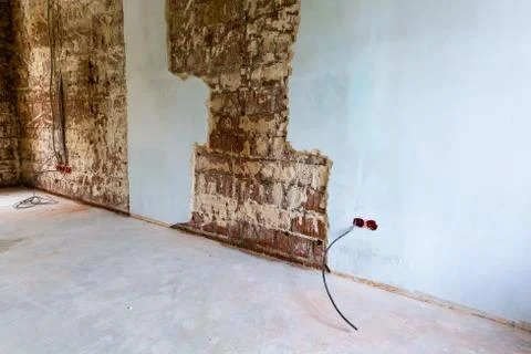 Working process to groove or wall chasing for electrical, internet cables and Stock Photos