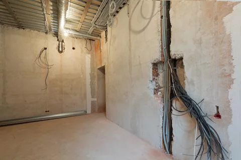 Working process to groove or wall chasing for electrical, internet cables and Stock Photos