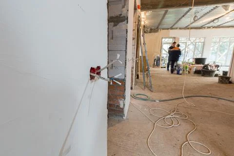 Working process to groove or wall chasing for electrical, internet cables and Stock Photos