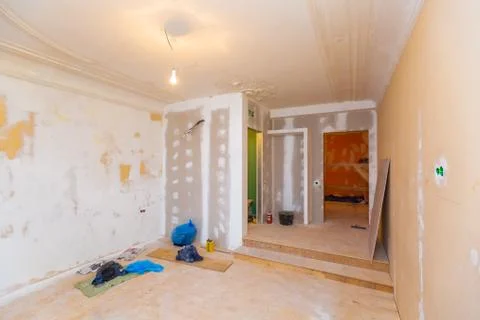 Working process of installing frames for plasterboard - drywall and construction Stock Photos