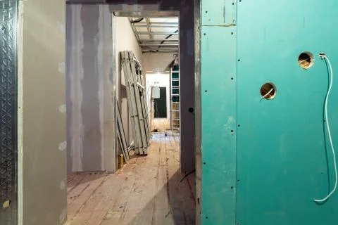 Working process of installing frames for plasterboard - drywall and construction Stock Photos