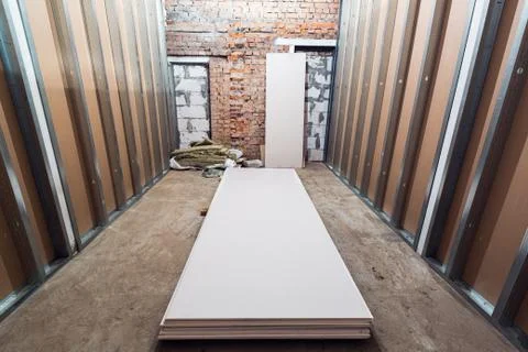 Working process of installing frames for plasterboard - drywall and construction Stock Photos