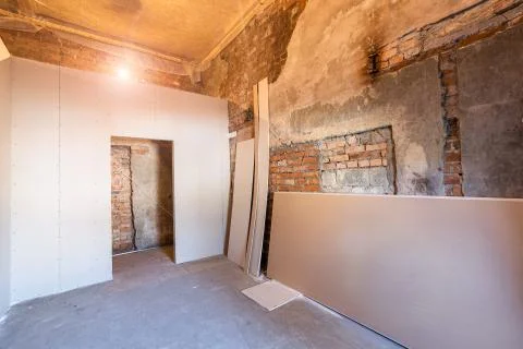 Working process of installing frames for plasterboard - drywall and construction Stock Photos