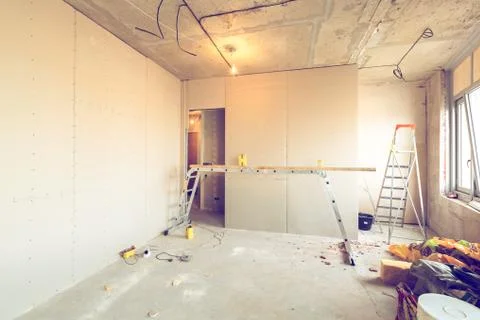 Working process of installing frames for plasterboard - drywall and construction Stock Photos
