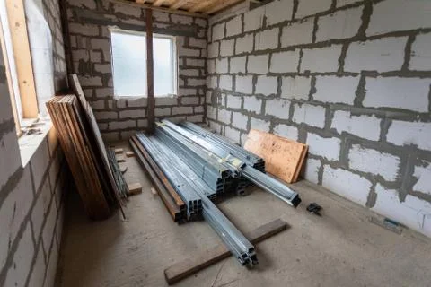 Working process of installing metal frames for plasterboard drywall for making Stock Photos