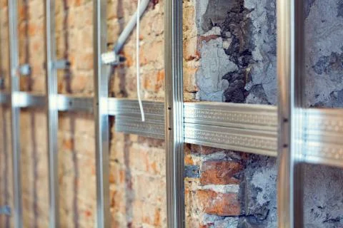 Working process of installing metal frames for plasterboard -drywall - for Stock Photos