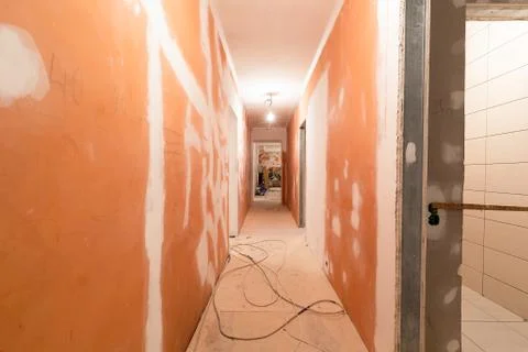Working process of installing plasterboard or drywall for making gypsum walls in Stock Photos