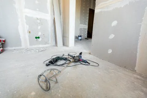 Working process of installing plasterboard or drywall - for making gypsum walls Stock Photos