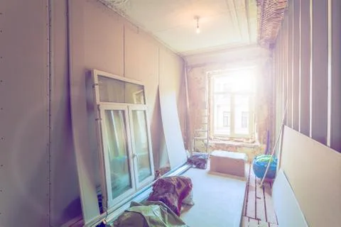 Working process of installing pvc windows and metal frames for plasterboard Stock Photos