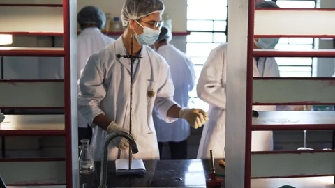 The working process in a laboratory. Scientists are getting ready to start Stock Footage 115804092