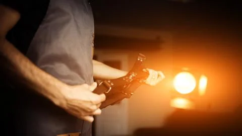 Working process of the leather craft in the workshop. Man holding photographer's Stock Photos