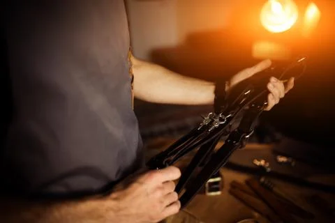 Working process of the leather craft in the workshop. Man holding photographer's Stock Photos