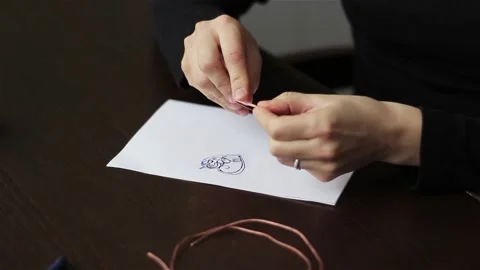  working process making jewelry sketch for wire wrapped bijouterie top view.  動画素材 87010010