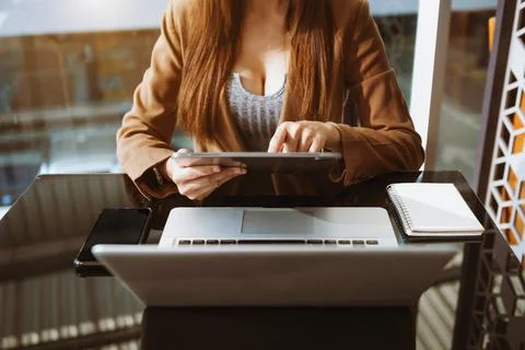 Working Process in Modern Office. Young Woman Account Manager Working at Wood Stock Photos
