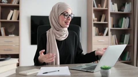 Working process at office of young girl in headscarf. Stock Footage 231733645