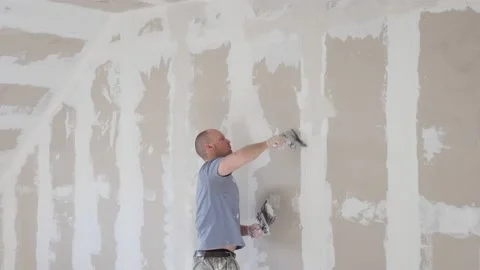 Working process of plasterboard drywall for making gypsum walls in apartment Stock Footage