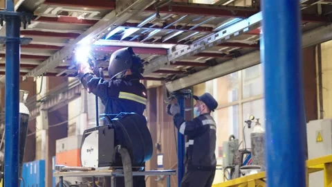 Working process at train car manufacturing plant. factory workers in protective Stock Footage 202049005