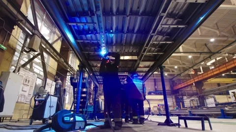 Working process at train car production factory. View from the bottom on workers Stock Footage 202049000