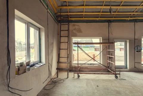 Working process of warming inside part of roof with using erecting stage in Stock Photos