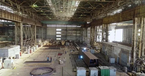 Working process in the workshop of steel structure factory. Welders welding Stock Footage 319193944