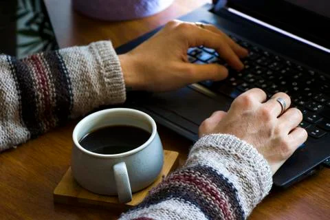 Working process, workspace and workspace, hand, coffee and notebook or laptop Stock Photos