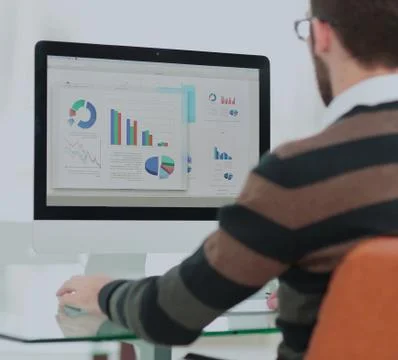 Working process, young manager working in a modern office.  Desk Stock Photos