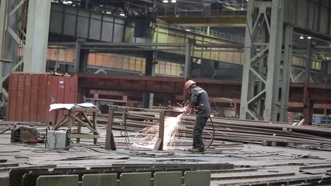 Working on the production and processing of metal in a large factory Stock Footage 73759147